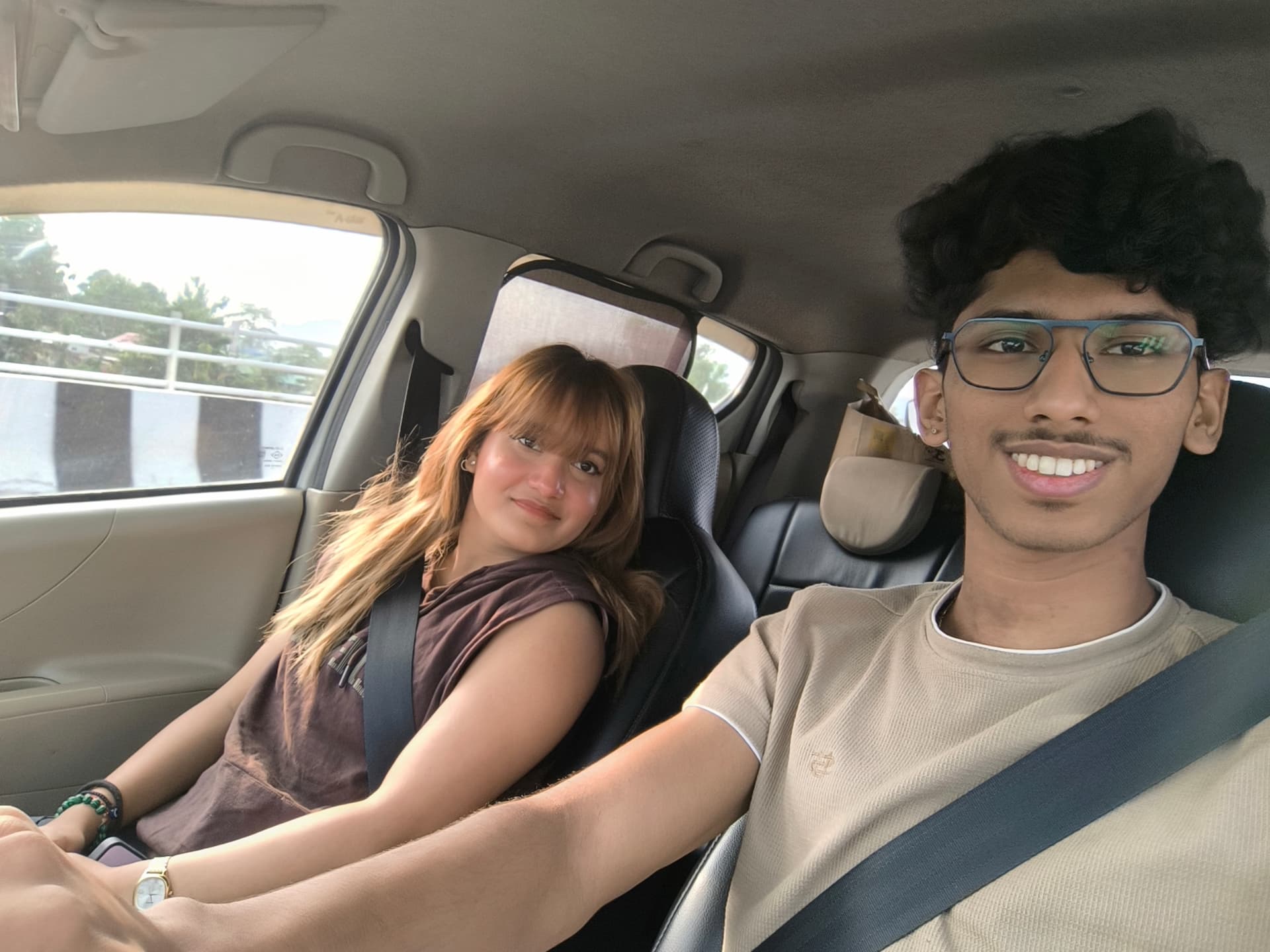 Sumitabh and Richa in a car, golden hour selfie