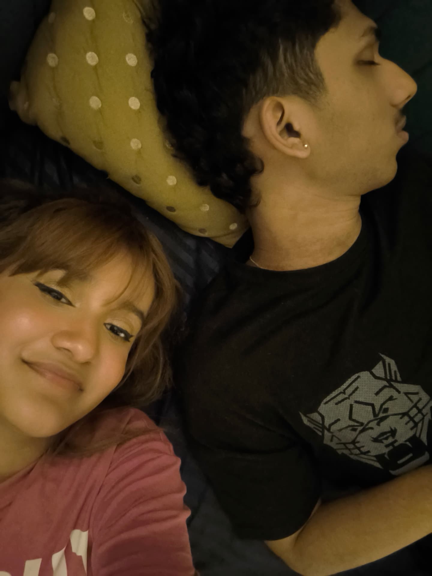Richa and Sumitabh lying side by side, cozy evening