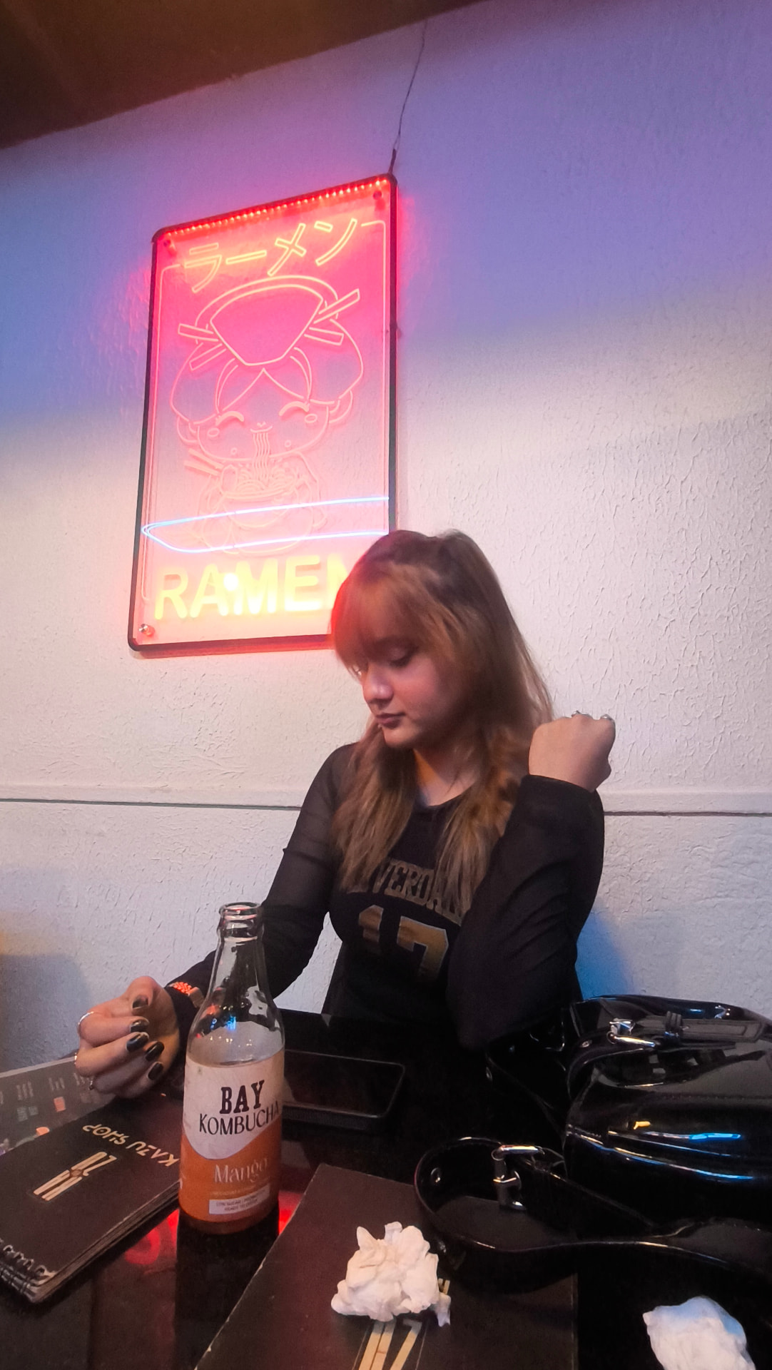 Richa at a ramen shop with kombucha